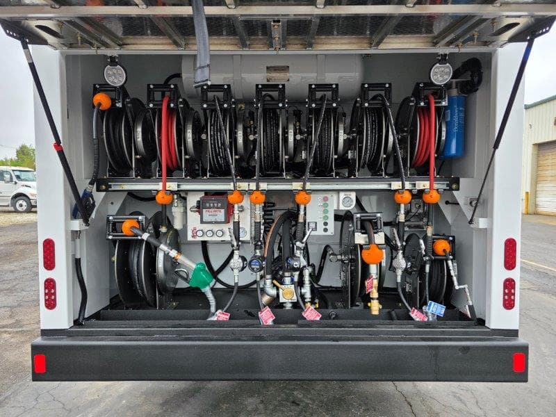 rear view of on road fuel lube truck showing hose reels and lube system